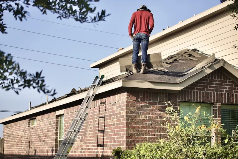 Professional roofer working on a residential roof in World Golf Village